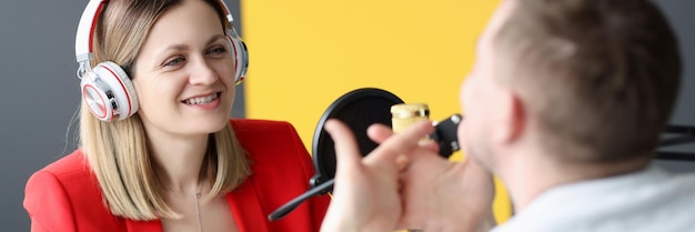 Student practicing voice exercises with guidance from experienced singing coach